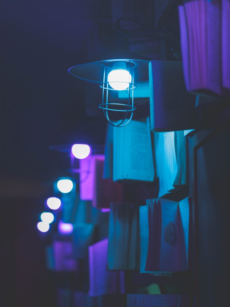 A picture of books under lightbulbs