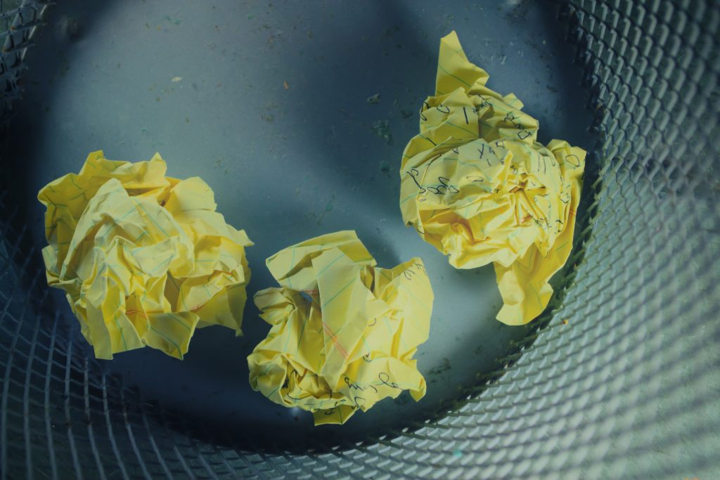 A picture of crumpled paper in a bin