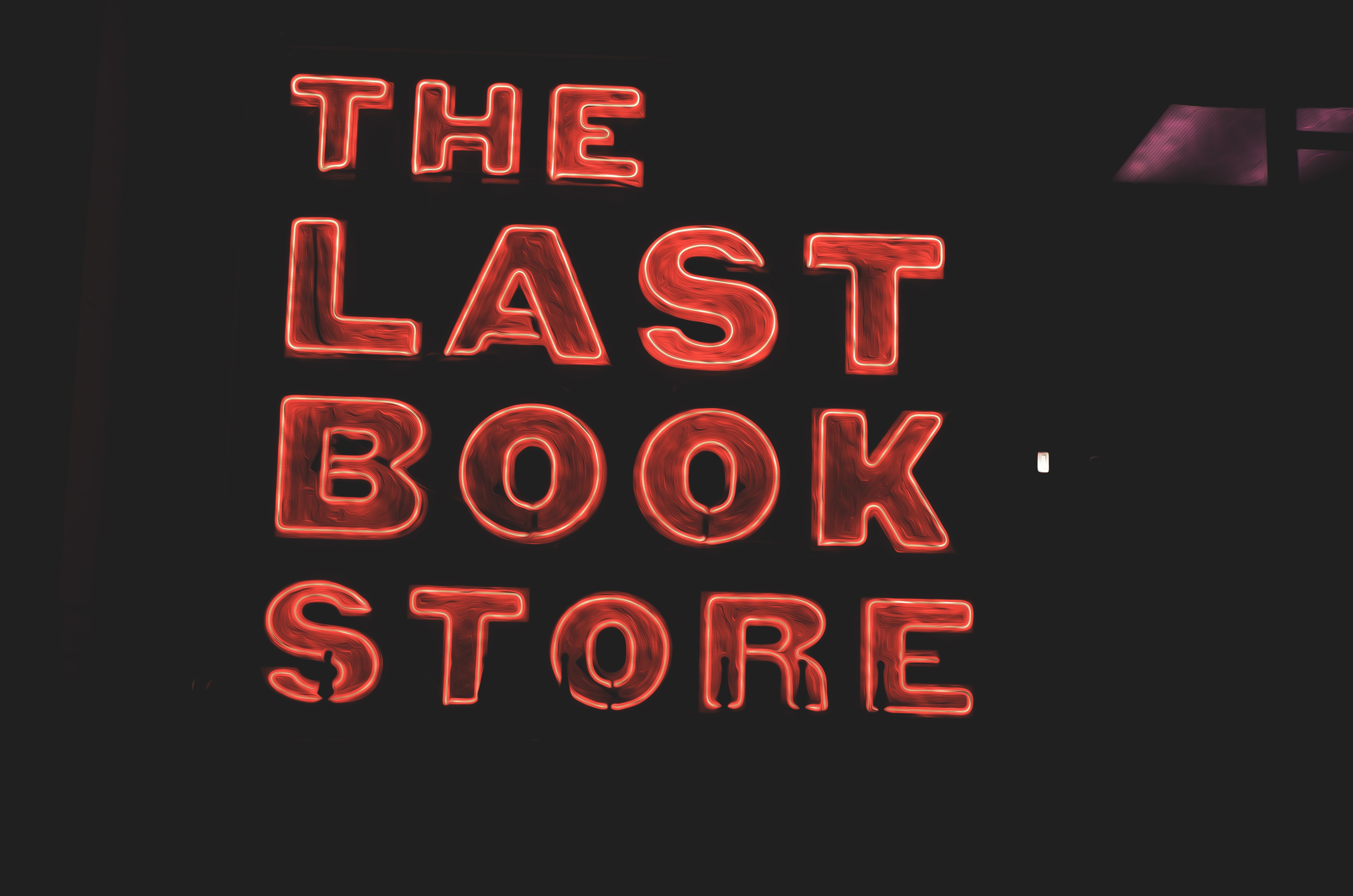 A picture of a neon sign for The Last Book Store