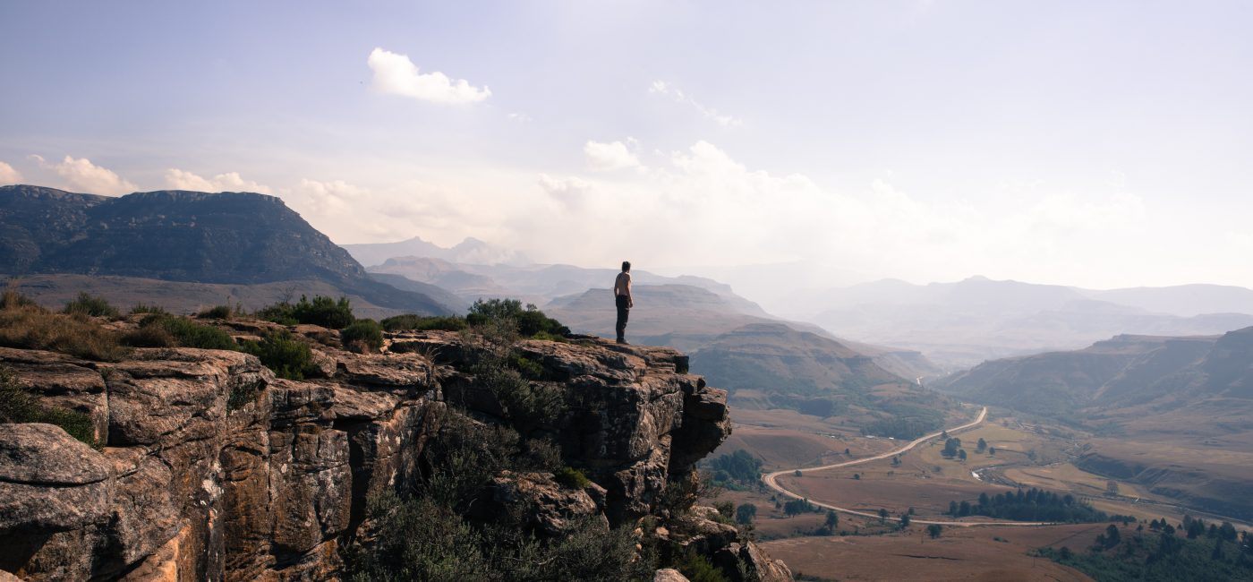 A picture of a person on a cliff edge