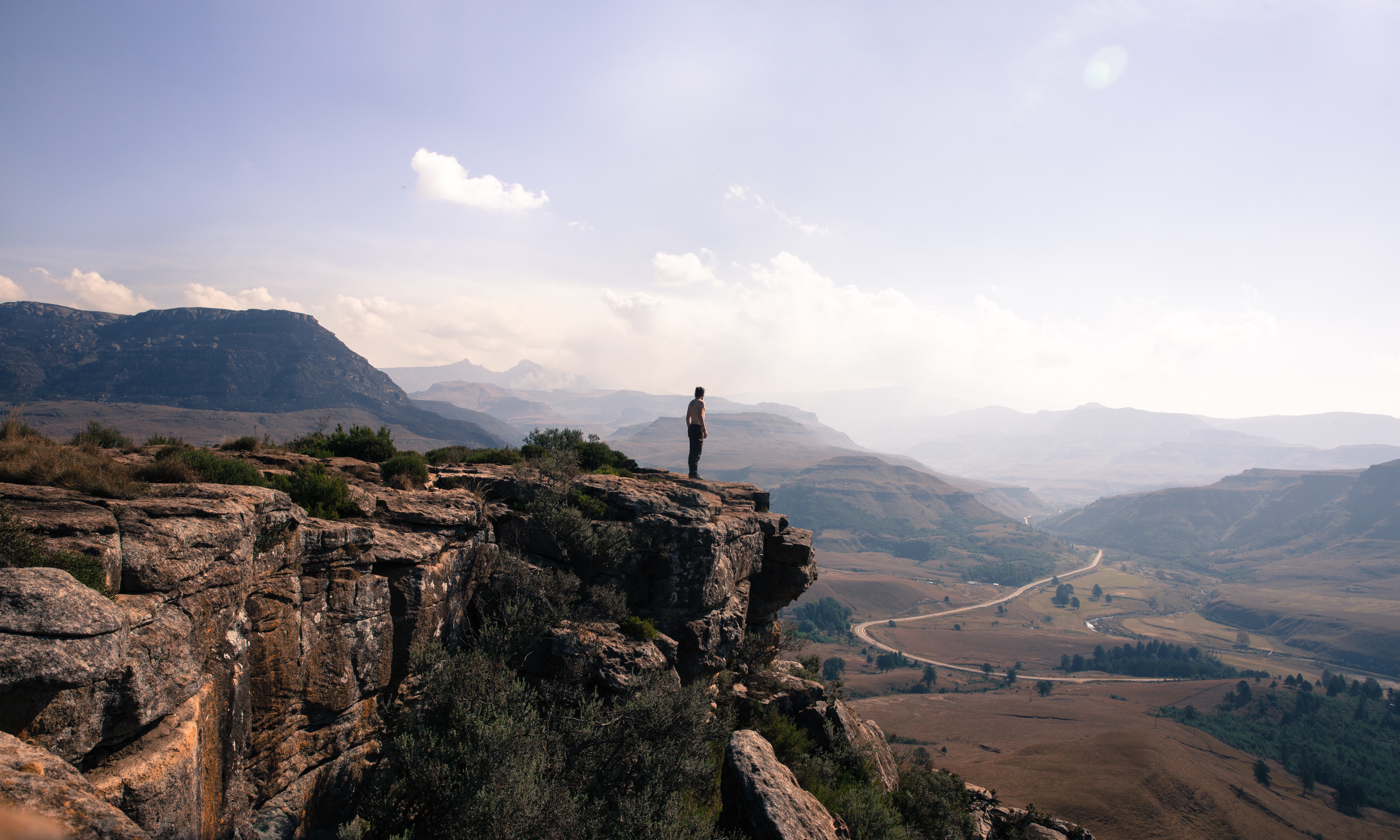 A picture of a person on a cliff edge